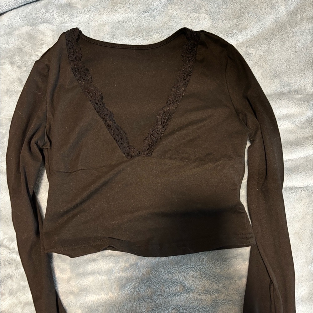 Black Lace skims top